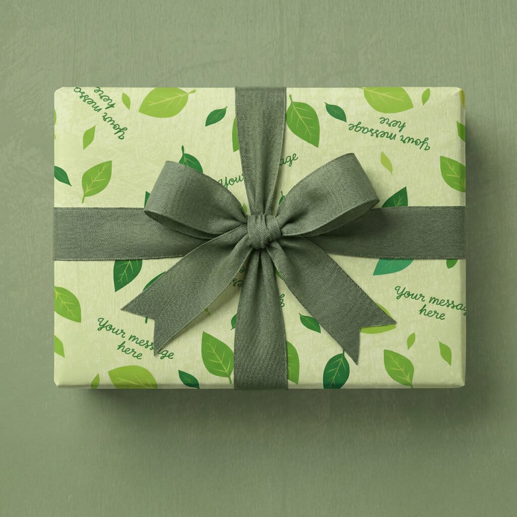Pale yellow-green background with scattered leaves in multiple shades of green including lime green, sage green, and forest green. Leaves are oval-shaped with visible vein details and vary in size, positioned at different angles throughout. Multiple placeholder text elements reading "your message here" in dark teal handwritten script font are scattered at various angles across the design.