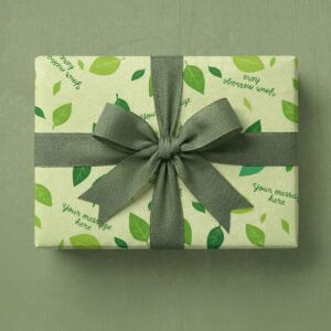 Pale yellow-green background with scattered leaves in multiple shades of green including lime green, sage green, and forest green. Leaves are oval-shaped with visible vein details and vary in size, positioned at different angles throughout. Multiple placeholder text elements reading "your message here" in dark teal handwritten script font are scattered at various angles across the design.