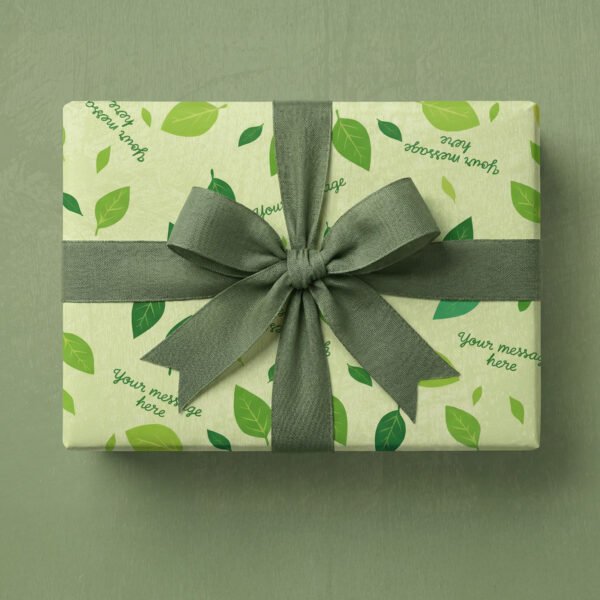 Pale yellow-green background with scattered leaves in multiple shades of green including lime green, sage green, and forest green. Leaves are oval-shaped with visible vein details and vary in size, positioned at different angles throughout. Multiple placeholder text elements reading "your message here" in dark teal handwritten script font are scattered at various angles across the design.