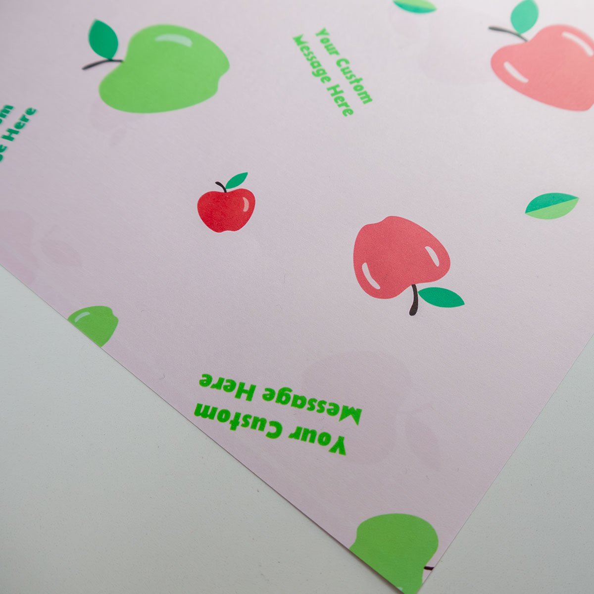 Apple Picking wrapping paper - red and green apples with personalised message on pink