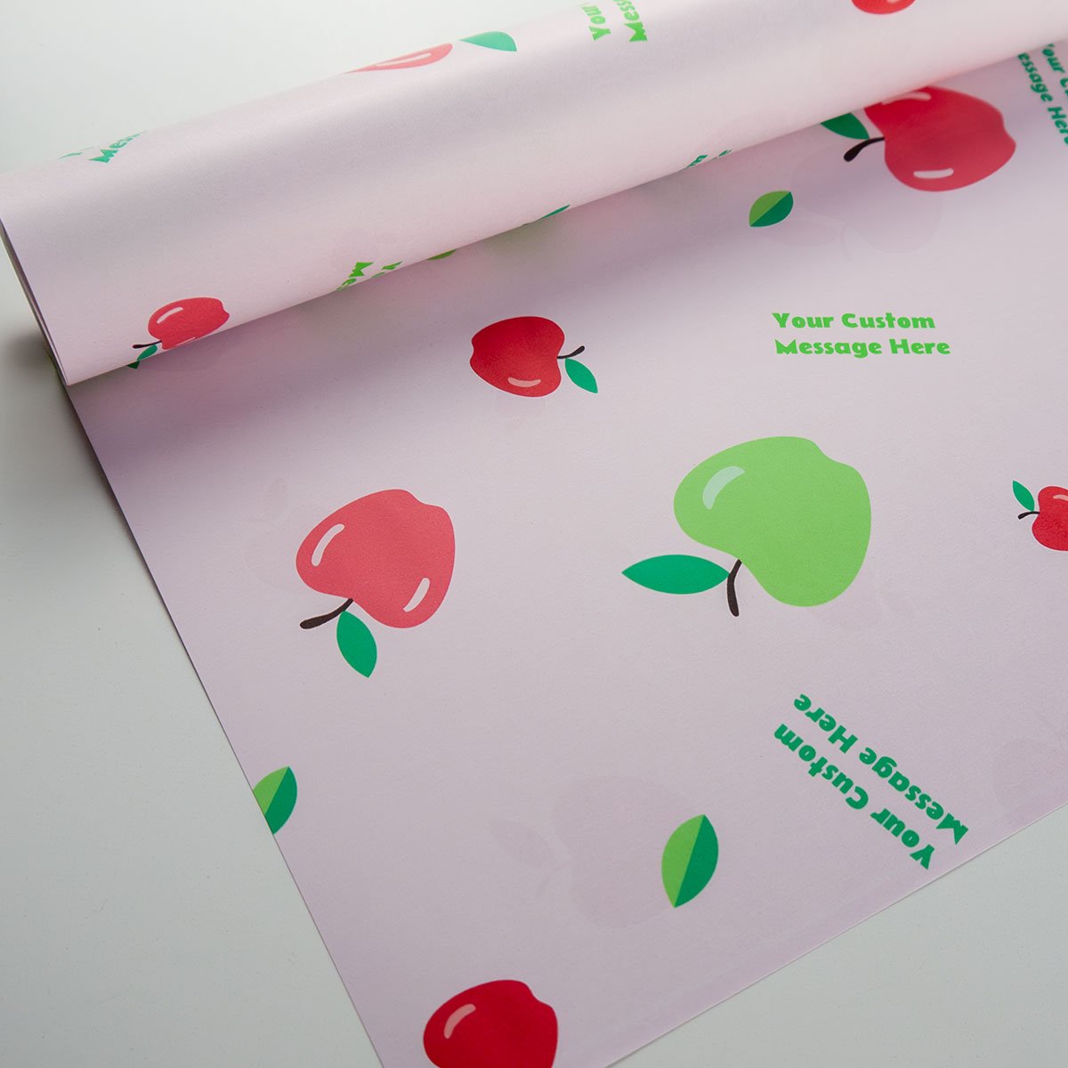 Apple Picking wrapping paper - red and green apples with personalised message on pink